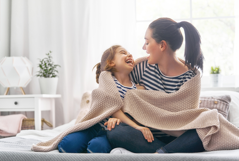 Child and parent after sleep apnea treatment in Livingston, NJ