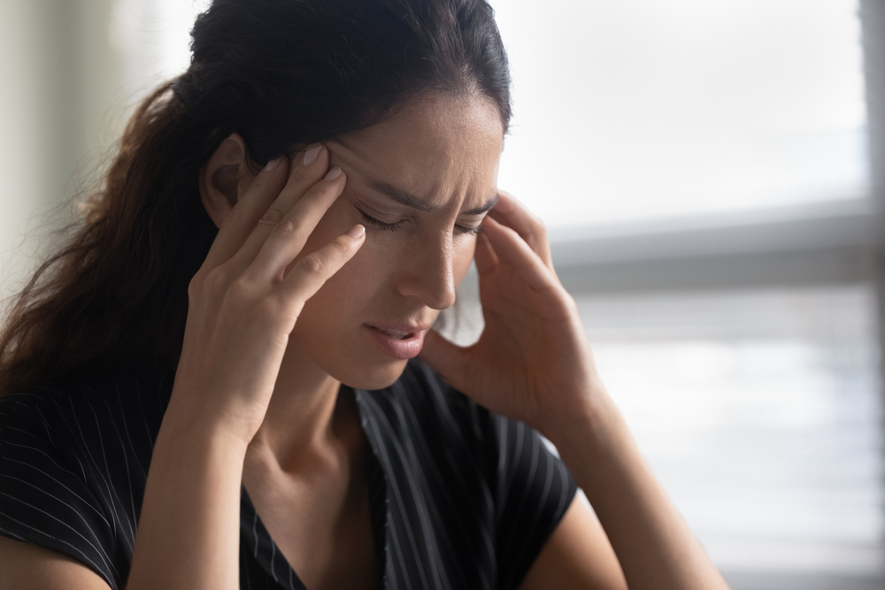 Woman experiencing sleep apnea symptoms in West Orange, NJ