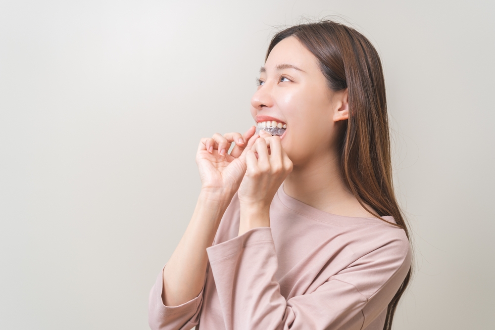 Woman with custom oral appliance for sleep apnea in Livingston, NJ