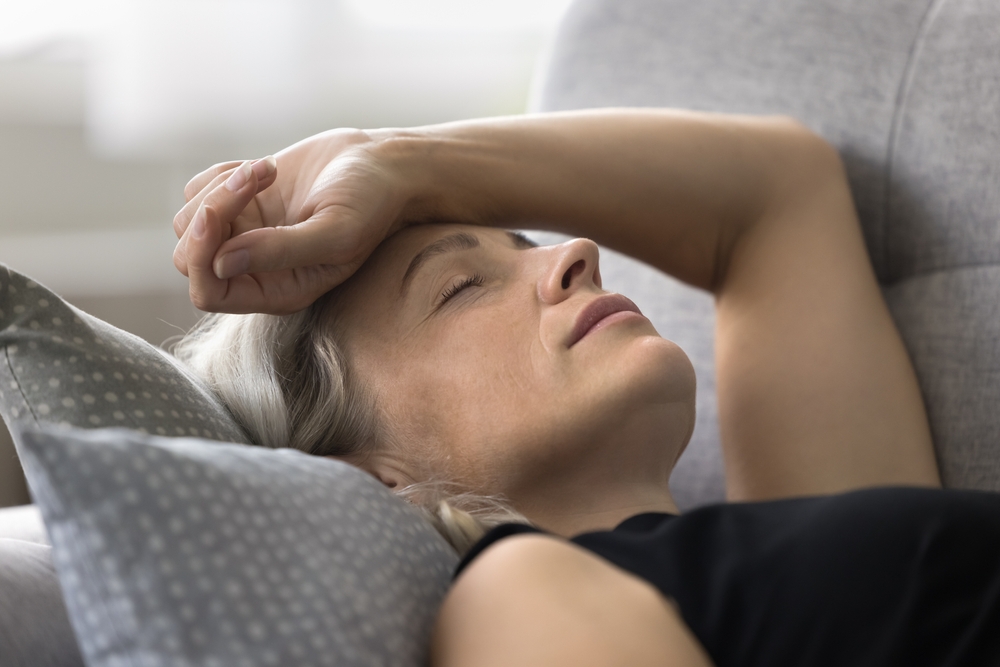 Woman sleeps on the couch.